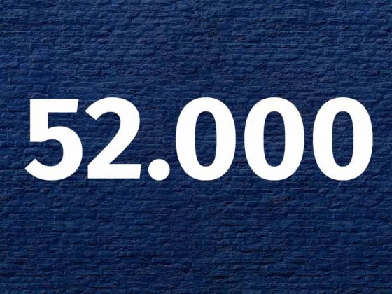 Die Zahl 52.000 in weißer Schrift vor einem blauen Hintergrund - Neubauwohnungen